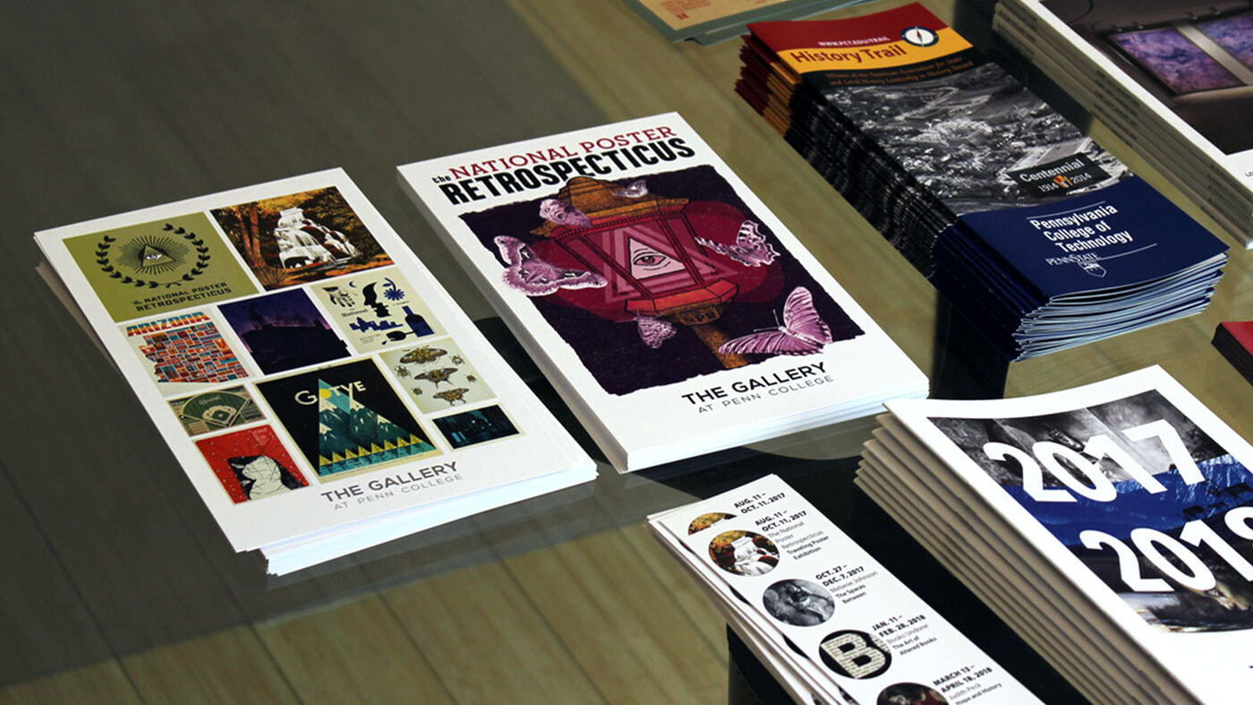 Postcards and poster on a display table